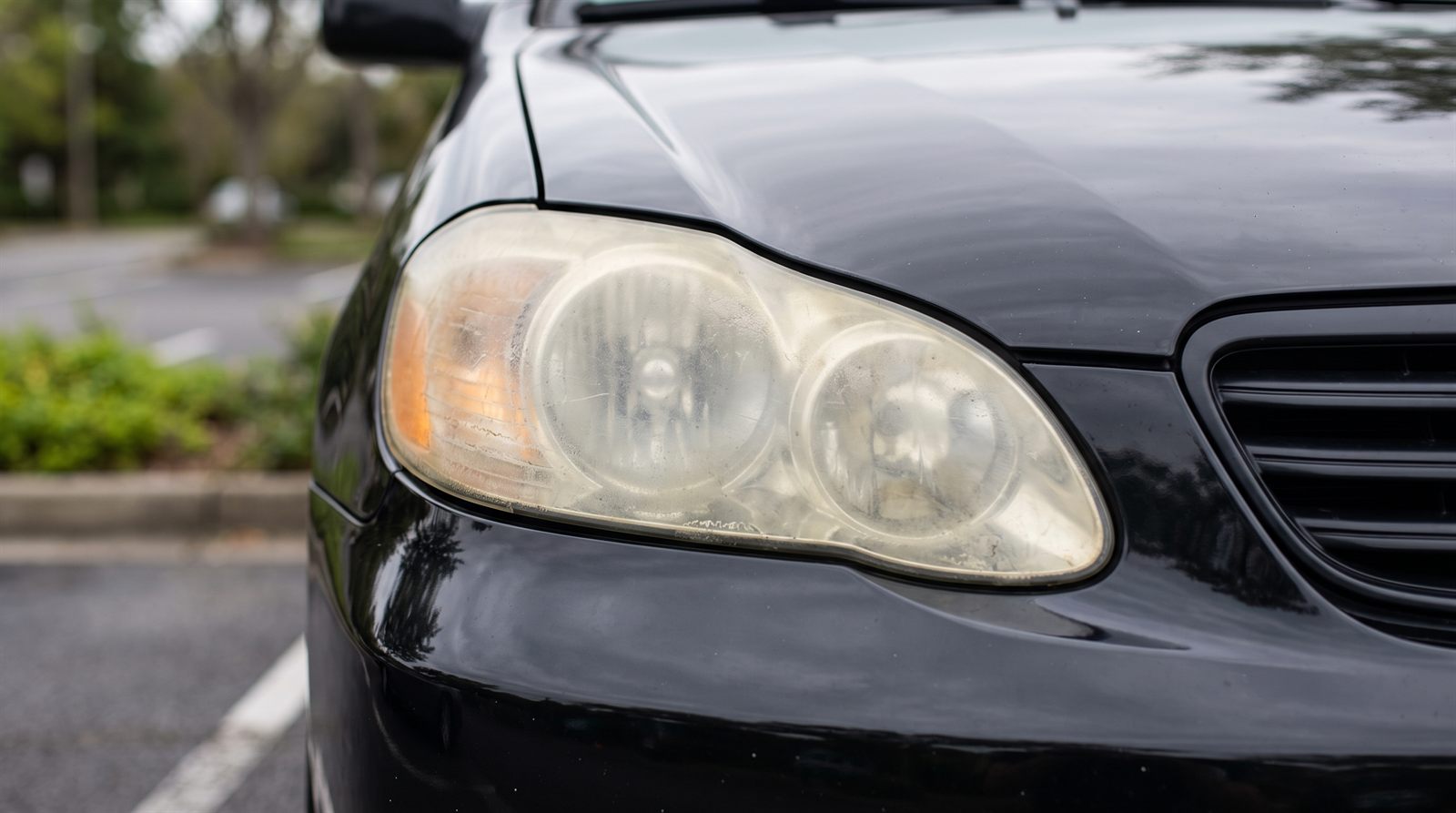 Before — foggy, yellowed headlight